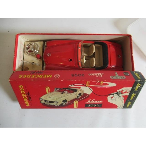 489 - Schuco 2095 Mercedes 190SL with remote steering finished in red with accessories, box G, model G-E (... 