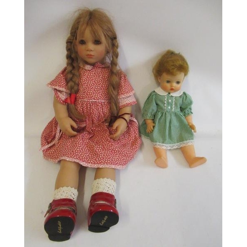 49 - Two late 20th century dolls, comprising a 26