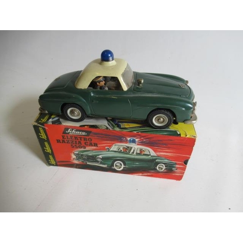 491 - Schuco 5509 Electro Razzia battery powered Police Mercedes 190SL finished in green/white, some minor... 