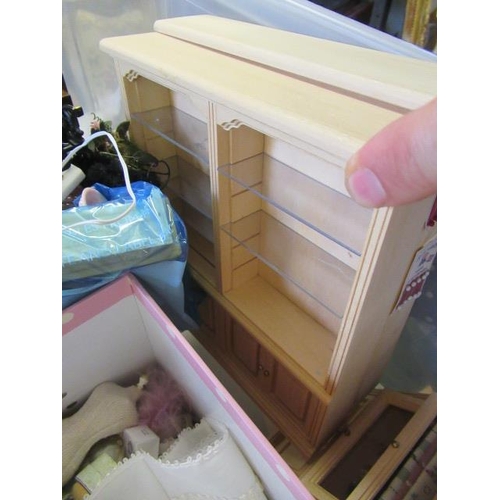 54 - A box of dolls house furniture, including wooden furniture, two metal and wood construction sewing m... 