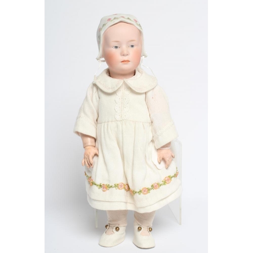 61 - A Gebruder Heubach solemn girl doll, with bisque socket head, moulded and painted eyes, facial featu... 