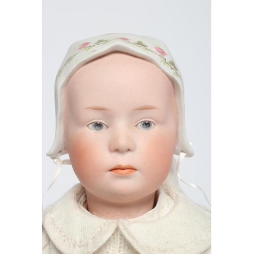 61 - A Gebruder Heubach solemn girl doll, with bisque socket head, moulded and painted eyes, facial featu... 