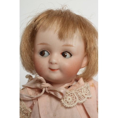 75 - A Gebruder Heubach googly eye bisque socket head doll, with brown glass sideways glancing sleeping e... 