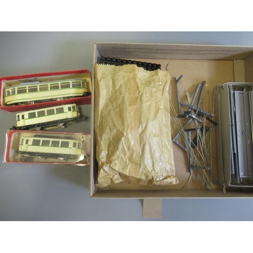 769 - Two HAMO tram models finished in cream, one two and another bogie, a small quantity of track and pan... 