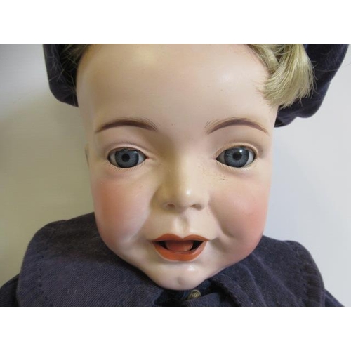 79 - A restored S.F.B.J. bisque head character boy doll, with blue glass sleeping eyes, wide open mouth, ... 