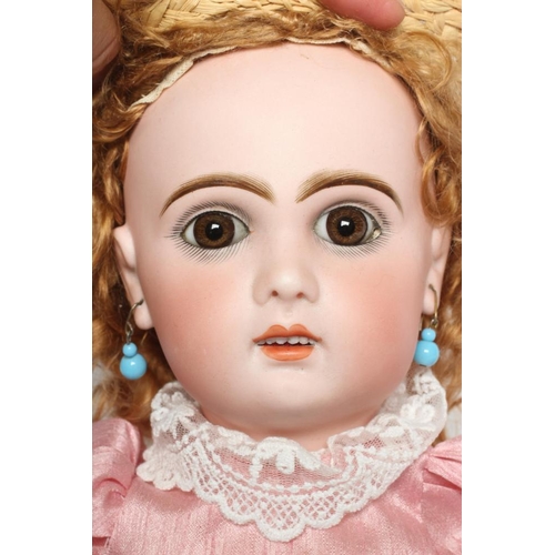 88 - A Bebe Jumeau bisque socket head doll, with brown glass fixed eyes, open mouth, teeth, pierced ears,... 