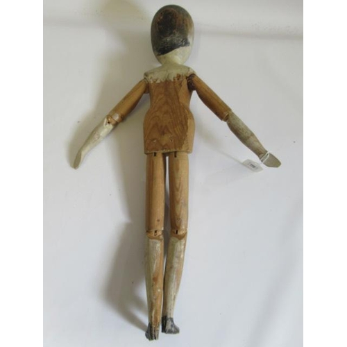 91 - A large Victorian peg doll, of all wood construction with painted face and hair, remnents of painted... 