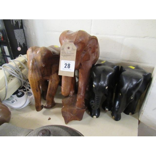 28 - FOUR WOODEN ELEPHANTS