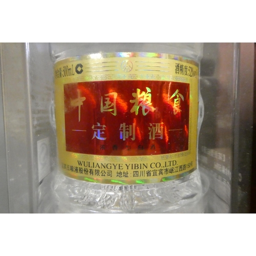 14 - 1 bottle Wuliangye Yibin Co. liqueur, 52%, 500ml, in presentation box, together with 1 litre Carlos ... 