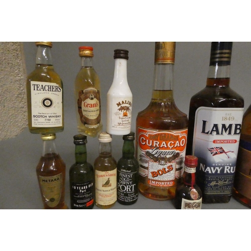 21 - A collection of mixed spirits and liqueur, including Lambs navy rum, Classic navy rum, Napoleon bran... 