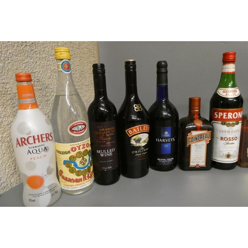 23 - A quantity of mixed spirits & liqueurs, including 1 litre Famous Grouse, 1 litre Grand Marnier, 1 bo... 