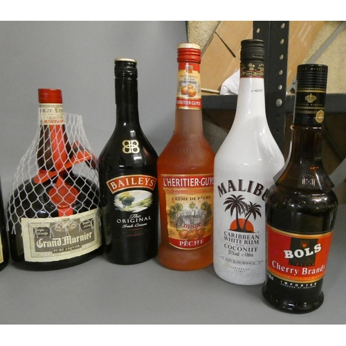 23 - A quantity of mixed spirits & liqueurs, including 1 litre Famous Grouse, 1 litre Grand Marnier, 1 bo... 