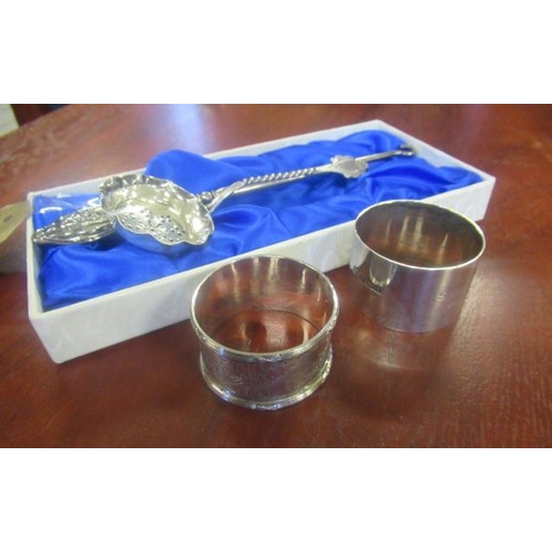 210 - TWO SILVER NAPKIN RINGS ETC