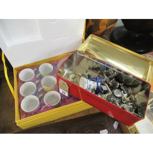 35 - BOXED COFFEE SET AND A TIN OF METAL ORNAMENTS ETC