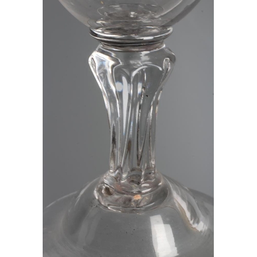 107 - A GLASS GOBLET, late 18th century, the rounded bowl on a wrythen moulded flared cylindrical stem and... 