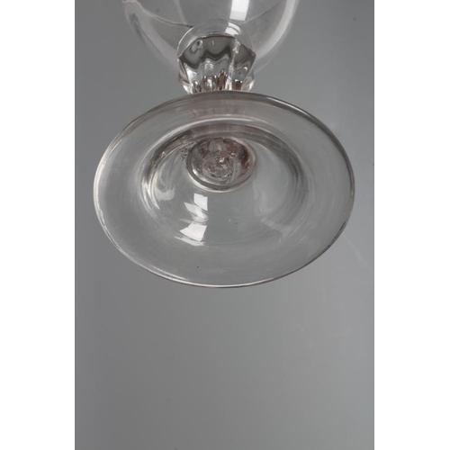 107 - A GLASS GOBLET, late 18th century, the rounded bowl on a wrythen moulded flared cylindrical stem and... 