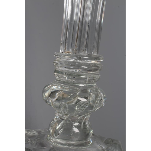 118 - A GLASS CANDLESTICK, mid 18th century, the moulded ribbed cylindrical socket with dished drip-pan, i... 