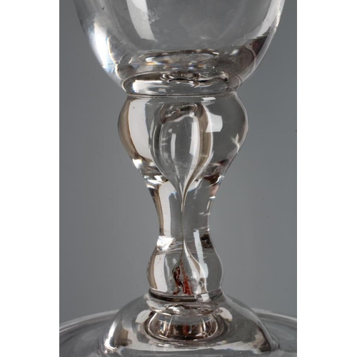 121 - A WINE GLASS, early 18th century, the round funnel bowl engraved with swags of flowers and rocaille ... 