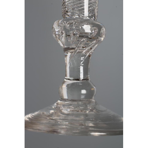 122 - A WINE GLASS, mid 18th century, the drawn trumpet bowl on a multiple spiral air twist stem with tear... 