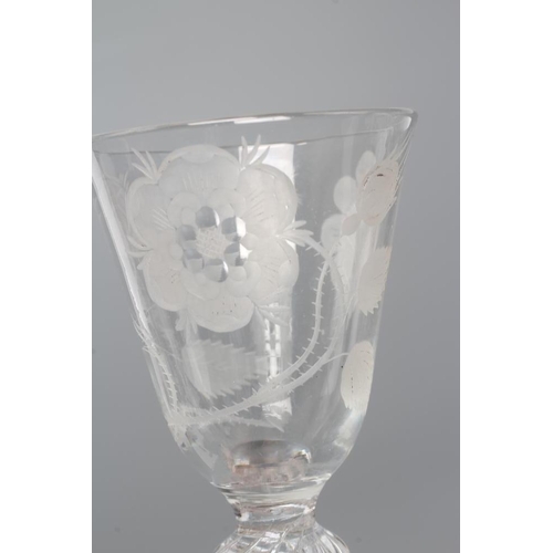 124 - A JACOBITE WINE GLASS, mid 18th century, the round funnel bowl engraved with a rose with one semi-op... 