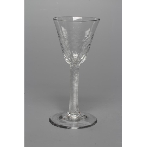 127 - A WINE GLASS, mid 18th century, the honeycomb moulded blown round funnel bowl on finely incised cyli... 