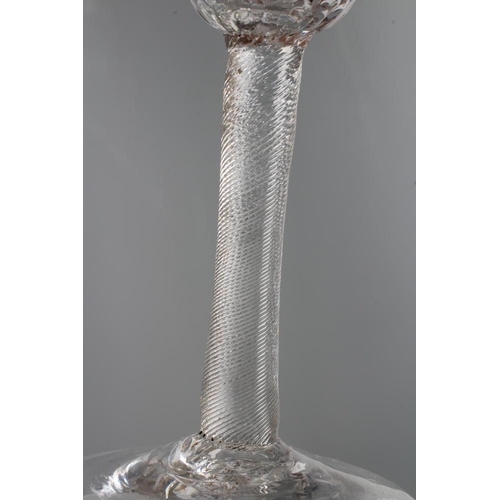 127 - A WINE GLASS, mid 18th century, the honeycomb moulded blown round funnel bowl on finely incised cyli... 