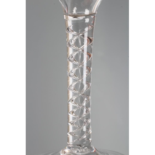 132 - A CORDIAL GLASS, mid 18th century, the ogee bowl on a plain cylindrical with a pair of air corkscrew... 