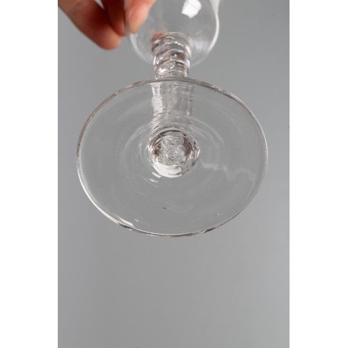 132 - A CORDIAL GLASS, mid 18th century, the ogee bowl on a plain cylindrical with a pair of air corkscrew... 