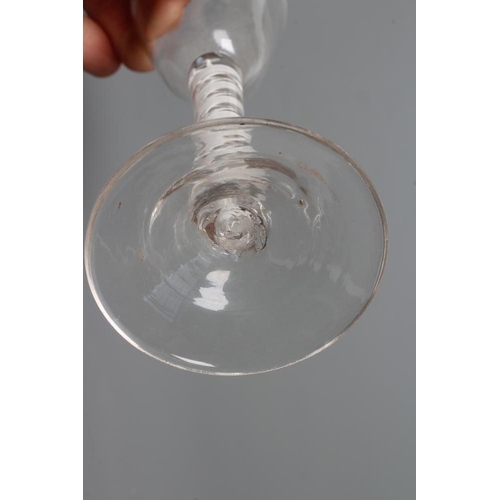 142 - A CORDIAL GLASS, mid 18th century, the round funnel bowl on a mixed twist stem with a pair of air tw... 