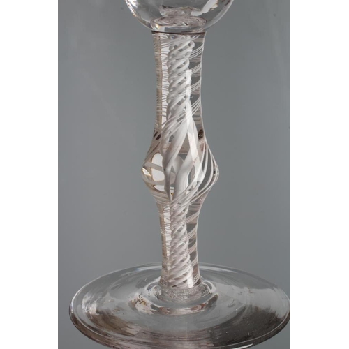 145 - A WINE GLASS, mid 18th century, the round funnel bowl with faint moulded vertical fluting to the bas... 