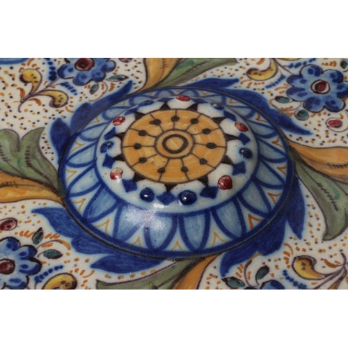 15 - A SPANISH MAIOLICA CHARGER, probably 19th century Talavera, of circular form with central raised bos... 