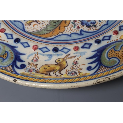 15 - A SPANISH MAIOLICA CHARGER, probably 19th century Talavera, of circular form with central raised bos... 