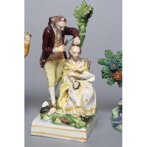 31 - A STAFFORDSHIRE PEARLWARE FIGURE GROUP, c.1820, modelled after a Derby original of a male hairdresse... 