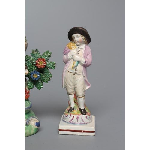 31 - A STAFFORDSHIRE PEARLWARE FIGURE GROUP, c.1820, modelled after a Derby original of a male hairdresse... 