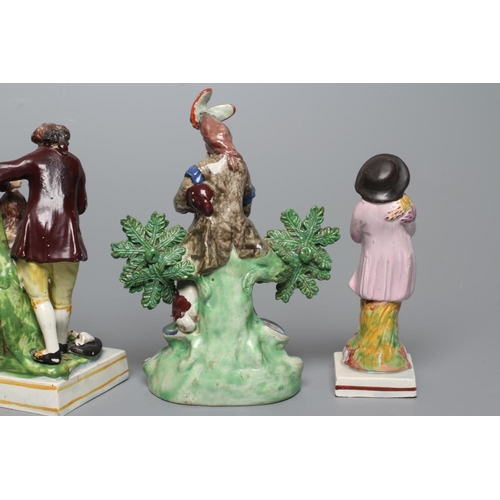 31 - A STAFFORDSHIRE PEARLWARE FIGURE GROUP, c.1820, modelled after a Derby original of a male hairdresse... 