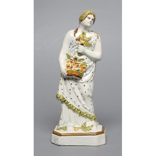 32 - A PRATTWARE FIGURE. c.1800, possibly Flora, wearing a laurel wreath in her brown hair, holding a pos... 