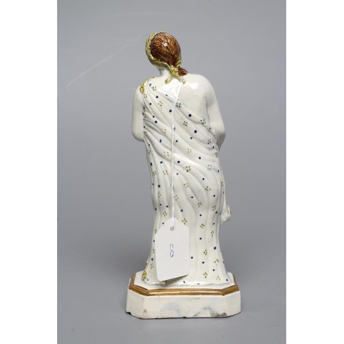 32 - A PRATTWARE FIGURE. c.1800, possibly Flora, wearing a laurel wreath in her brown hair, holding a pos... 