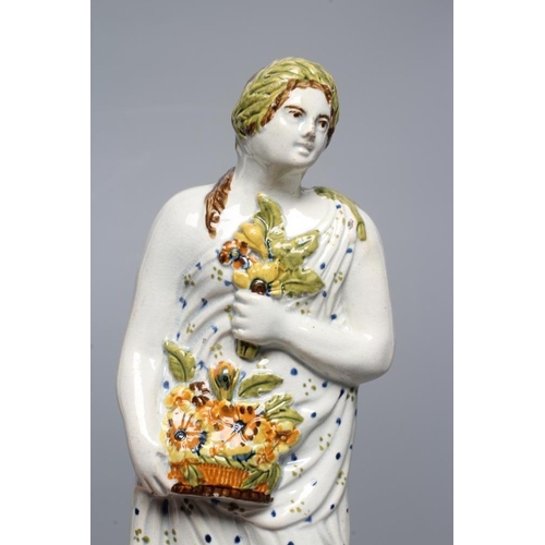 32 - A PRATTWARE FIGURE. c.1800, possibly Flora, wearing a laurel wreath in her brown hair, holding a pos... 