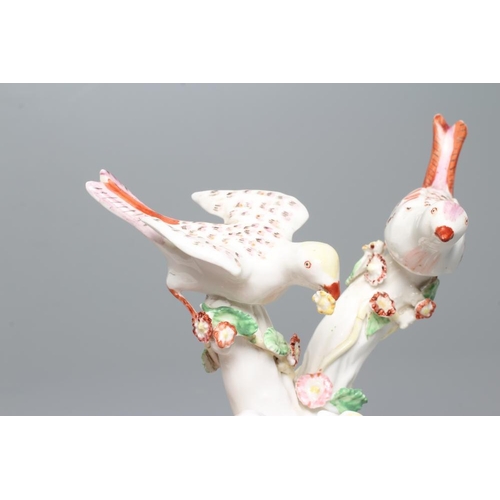 34 - A BOW PORCELAIN GROUP, c.1760, modelled as two birds perched upon flower encrusted branches with a d... 