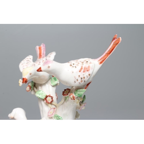 34 - A BOW PORCELAIN GROUP, c.1760, modelled as two birds perched upon flower encrusted branches with a d... 