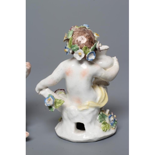 35 - A PAIR OF BOW PORCELAIN PUTTI, c.1760, modelled naked with flower garlands in their hair, seated and... 