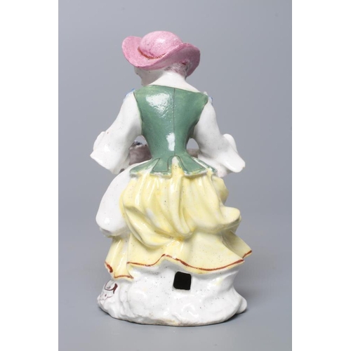 36 - A BOW PORCELAIN FIGURE, c.1760, modelled as a young lady allegorical of Autumn from the seated Rusti... 