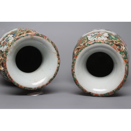 4 - A PAIR OF CANTONESE PORCELAIN FAMILLE ROSE VASES of cylindrical form with waisted necks, the shoulde... 