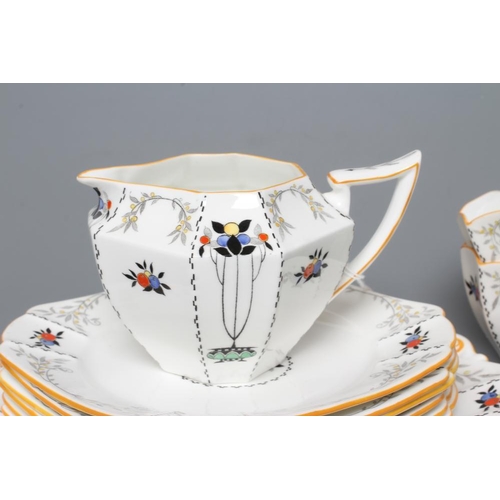 62 - AN ART DECO SHELLEY CHINA QUEEN ANNE TEA SERVICE printed and overpainted with the 