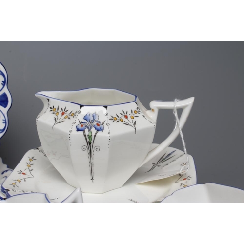 63 - AN ART DECO SHELLEY CHINA QUEEN ANNE TEA SERVICE printed and overpainted with the Blue Iris pattern,... 