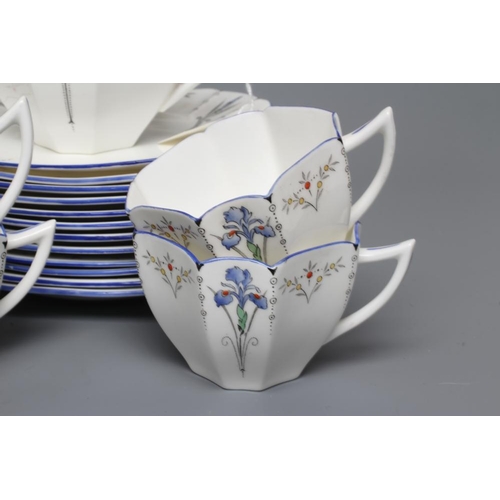 63 - AN ART DECO SHELLEY CHINA QUEEN ANNE TEA SERVICE printed and overpainted with the Blue Iris pattern,... 