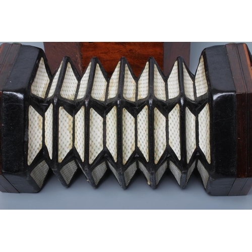 637 - A LACHENAL & CO., LONDON CONCERTINA, Serial No.180606, with rosewood ends and twenty one bone button... 