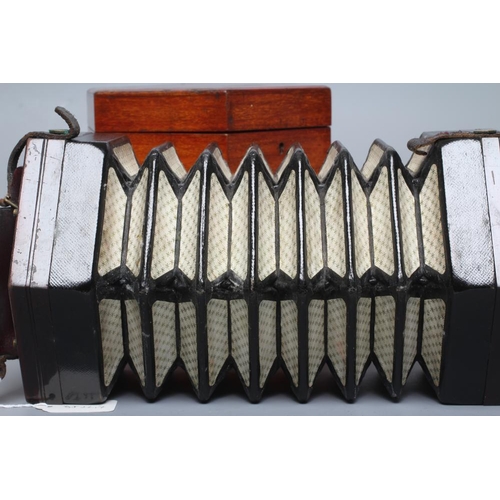 641 - A LACHENAL & CO., LONDON CONCERTINA, with rosewood ends and thirty nine bone buttons, maker's paper ... 