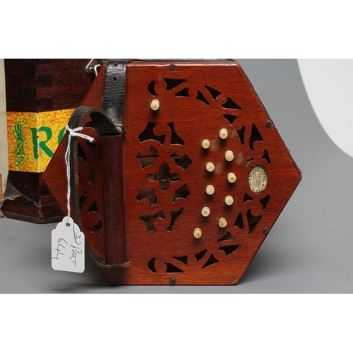 644 - A LACHENAL & CO., LONDON CONCERTINA, Serial No. 84297, with mahogany ends and twenty one bone button... 