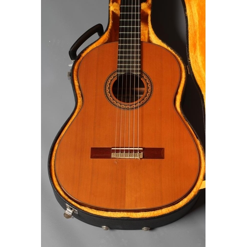 649 - A JAPANESE CLASSICAL GUITAR by Hiroshi Tamura, with red and black stained inlaid sound hole, the mac... 